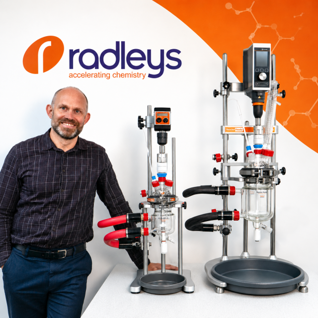 Stuart Crosby, R&D Manager, stood next to Reactor-Ready Mini, a low-volume process chemistry reactor, and Reactor-Ready Flex