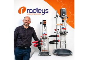Stuart Crosy, R&D Manager, stood next to Reactor-Ready Mini and Reactor-Ready Flex